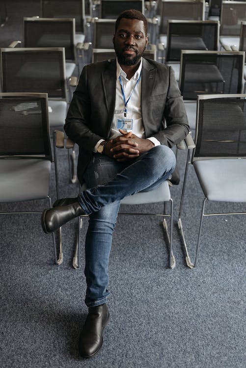 man wearing boots with suit