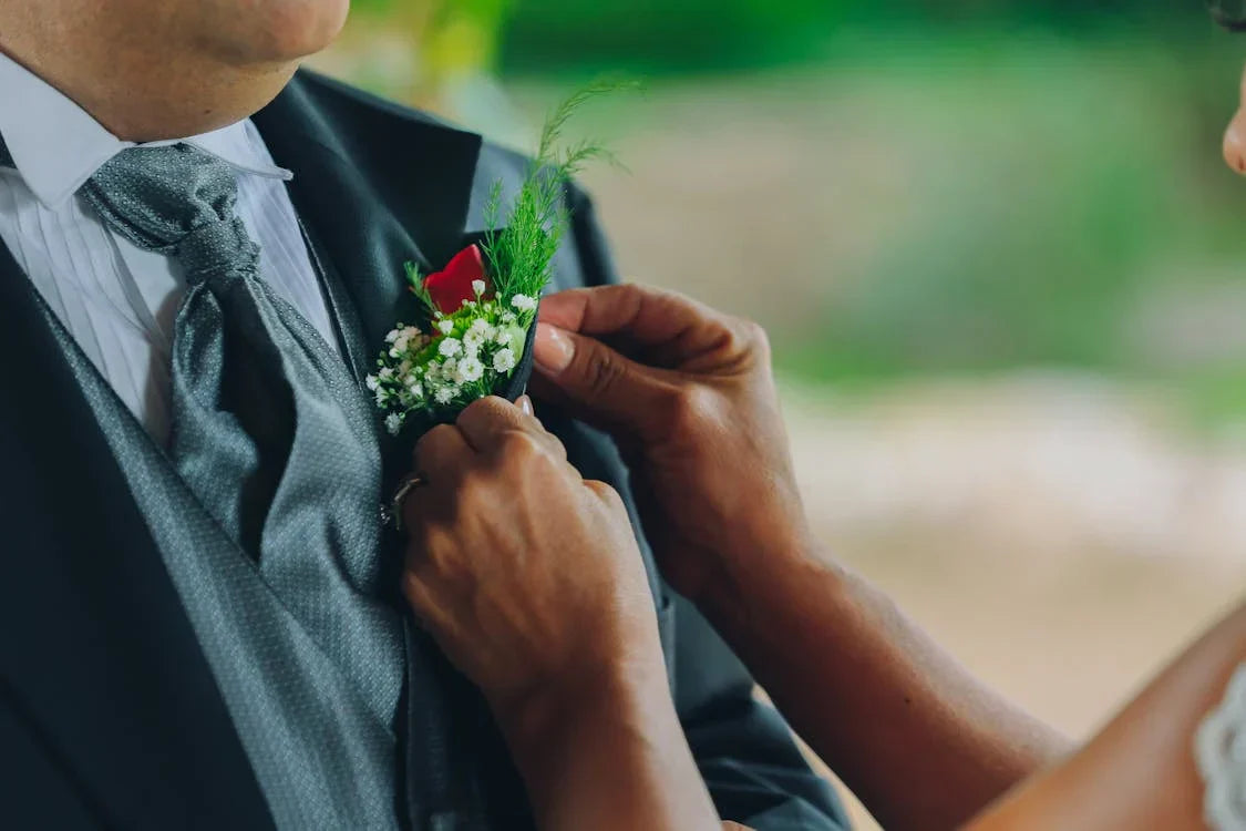 black suit green tie: close up shot of green tie