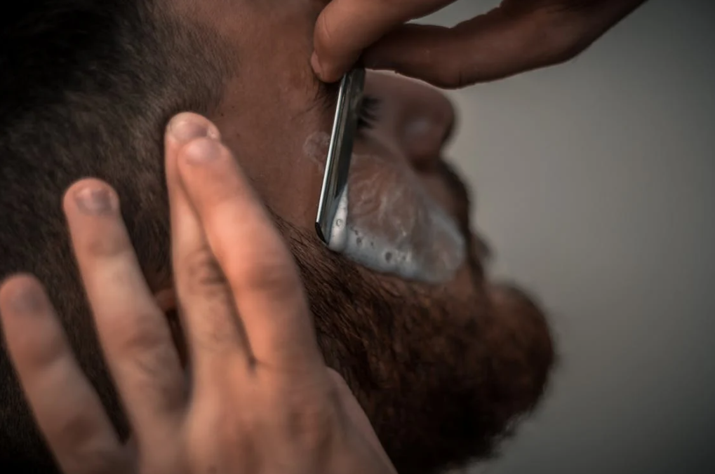 what is manscaping: man shaving beard