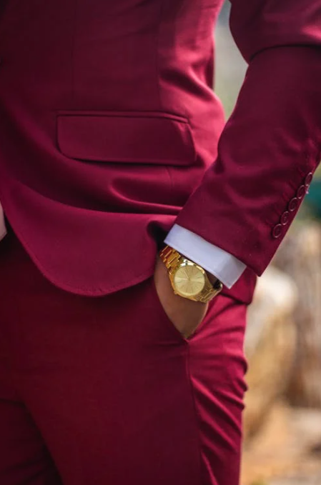 how tight should a watch be: man wearing suit and watch